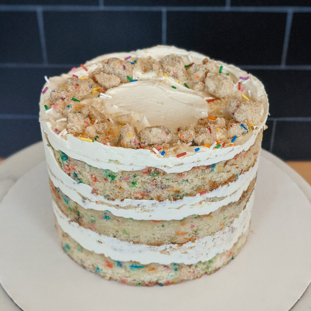 a three tiered cake with frosting